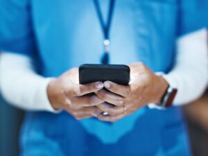 Phone Hands And Medical Nurse In Hospital Working